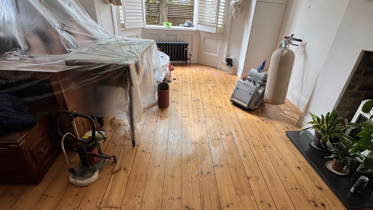 Professional equipment set up for Transforming Victorian Boards on original soft-wood pine boards in a Victorian living room.