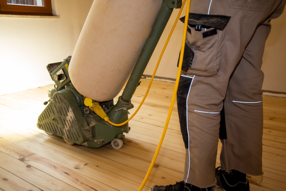 Victorian Floorboard Sanding in Isleworth – Restoring Pine Boards to Perfection Professional carrying out Victorian Floorboard Sanding in Isleworth on original Victorian pine boards in a freshly refurbished living room.