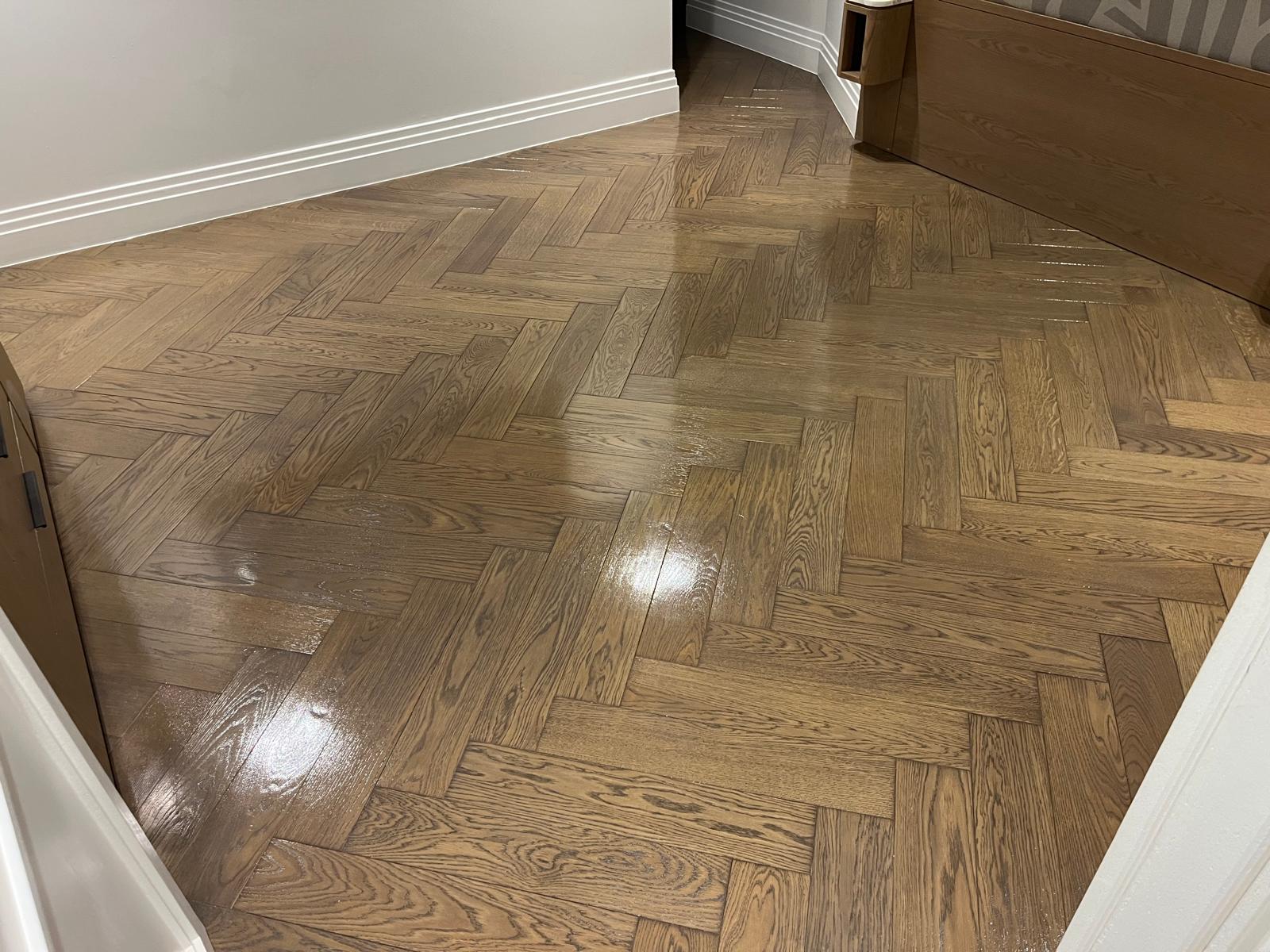 Parquet Floor Sanding in Isleworth on an oak herringbone parquet hallway floor, finished to a smooth, glossy sheen.
