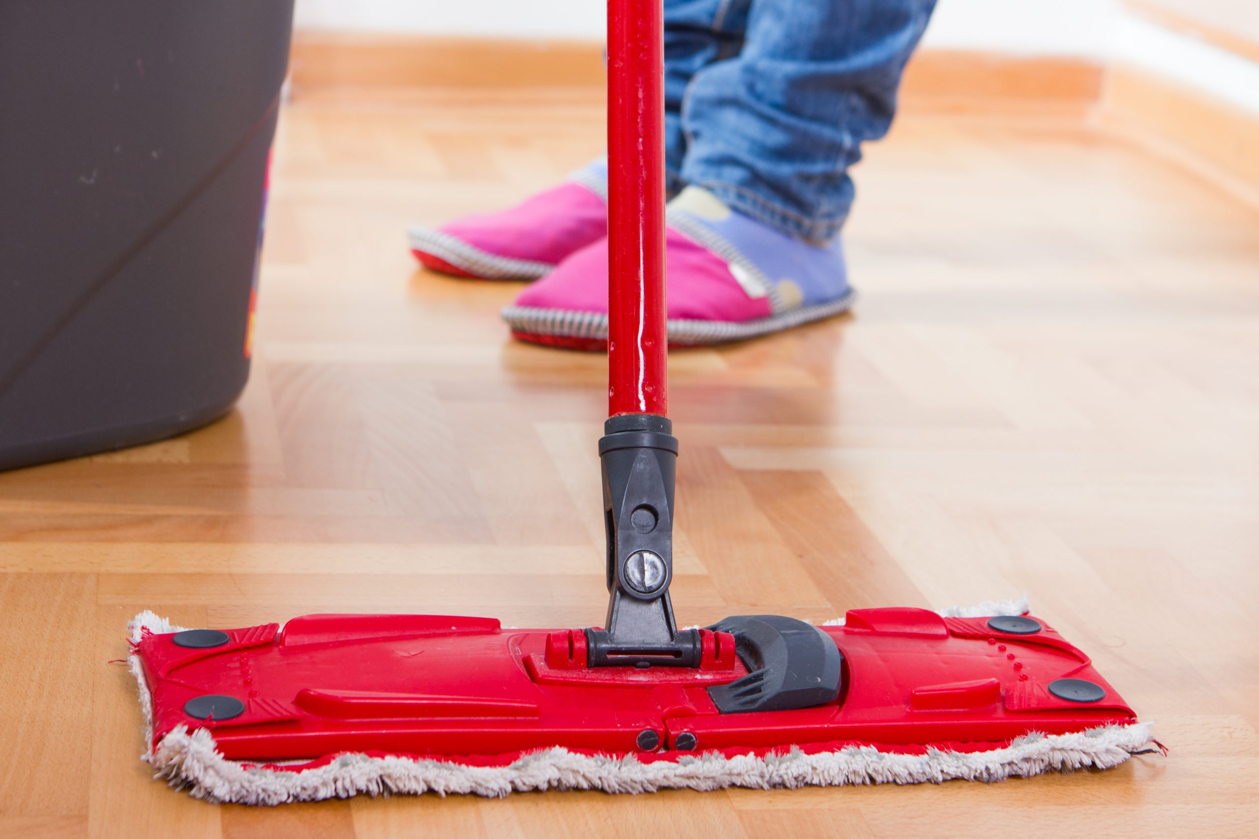 Parquet Floor Sanding in Isleworth – freshly restored oak parquet hardwood floor being gently cleaned with a flat mop for easy aftercare.